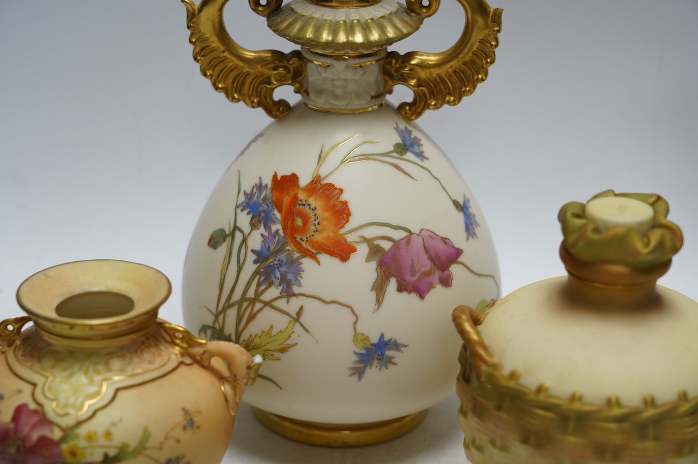 Four Worcester blush ivory floral pots and vases, 1176, 2538, 1728 & 1327, largest 22cm high. Condition - fair to good